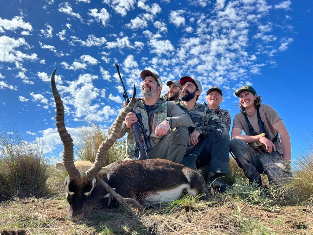 free range hunting at northern territories - group of men with guns and a blackbuck